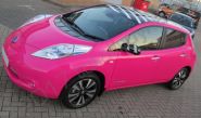 Nissan Leaf fully wrapped in a colour-matched pink vinyl car wrap