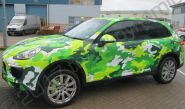 Porsche Cayenne vinyl wrapped in a printed green camouflage design