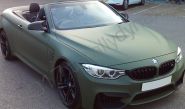 BMW M4 fully vinyl wrapped in a matt military green car wrap