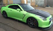 Nissan GTR vinyl wrapped in a pearlescent green car wrap with carbon fibre vinyl detailing
