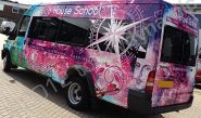Ford Transit Jumbo minibus vinyl wrapped in printed design by Totally Dynamic South London