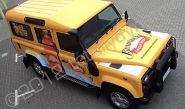 Land Rover Defender wrapped in printed yellow design by Totally Dynamic South London