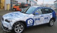 BMW X3 fully vinyl wrapped for Breckon & Breckon in a printed vinyl car wrap design by Totally Dynamic South London