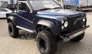 Modified Land Rover wrapped in dark blue metallic vinyl by Totally Dynamic South London