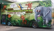 Double Decker Bus fully wrapped in a printed vinyl bus wrap for the Monkey Madness Fun Bus by Totally Dynamic Leeds