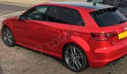 Audi S3 fully wrapped in a red chrome vinyl car wrap