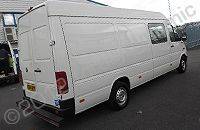 VW LT van fully wrapped in gloss black vinyl with print and cut graphics overlaid by Totally Dynamic North London