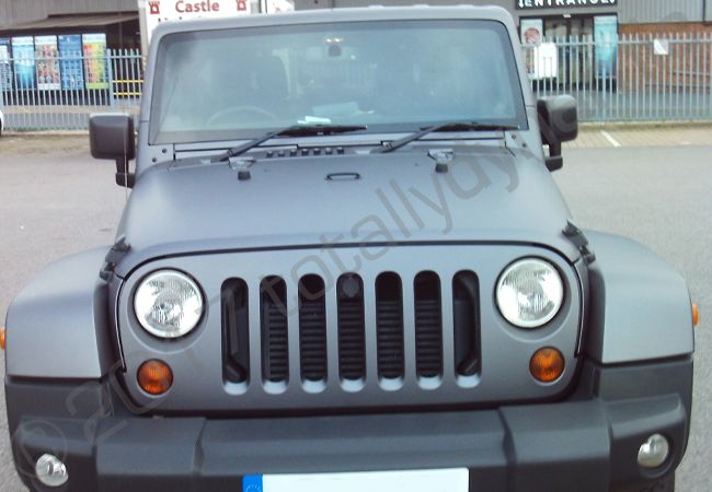 Jeep Wrangler fully vinyl wrapped in a matt metallic grey car wrap