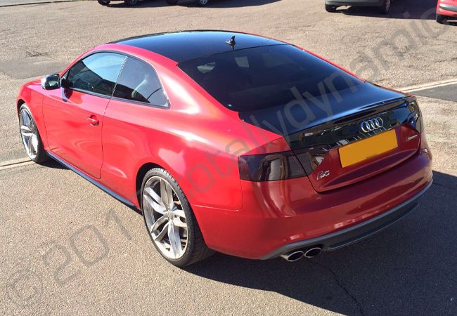 Audi S5 fully vinyl wrapped in a True Blood Red car wrap