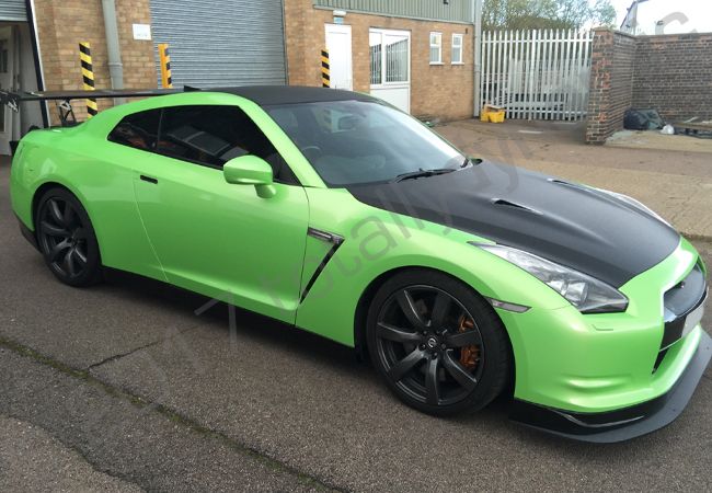 Nissan GTR vinyl wrapped in a pearlescent green car wrap with carbon fibre vinyl detailing