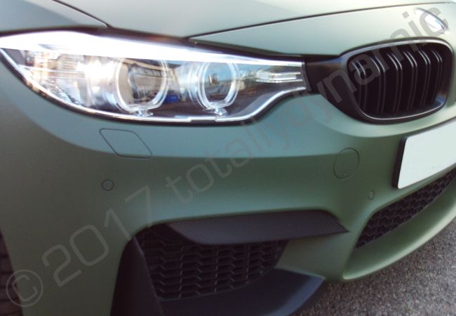 BMW M4 fully vinyl wrapped in a matt military green car wrap
