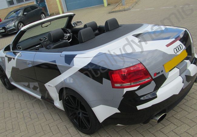 Audi RS4 vinyl wrapped in a printed grey camouflage car wrap
