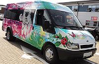Ford Transit Jumbo minibus vinyl wrapped in printed design by Totally Dynamic South London