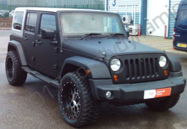 Jeep Wrangler fully vinyl wrapped in a matt black car wrap