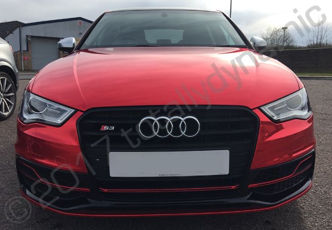 Audi S3 fully wrapped in a red chrome vinyl car wrap