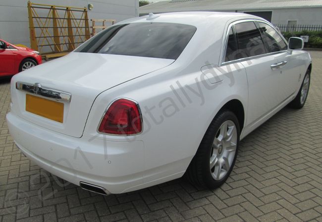 Rolls Royce Ghost fully wrapped in a gloss white vinyl car wrap