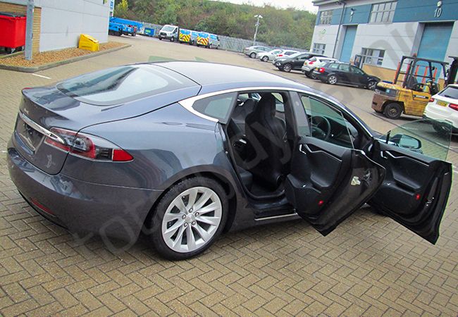 Tesla Model S fully vinyl wrapped in dark matt metallic grey