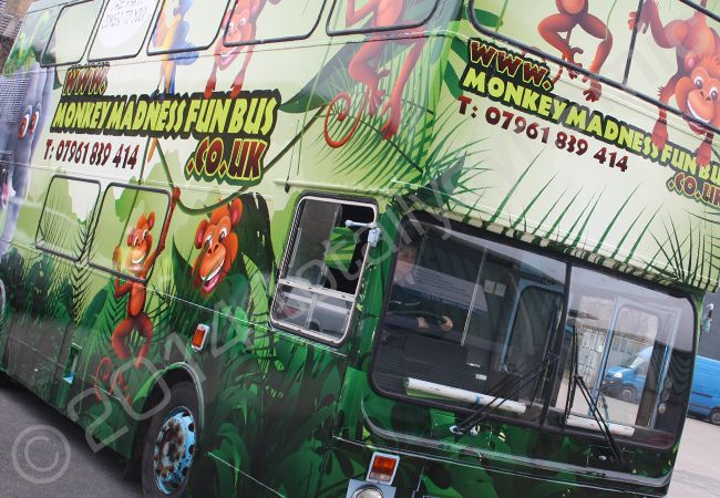 Double Decker Bus fully wrapped in a printed vinyl bus wrap for the Monkey Madness Fun Bus by Totally Dynamic Leeds