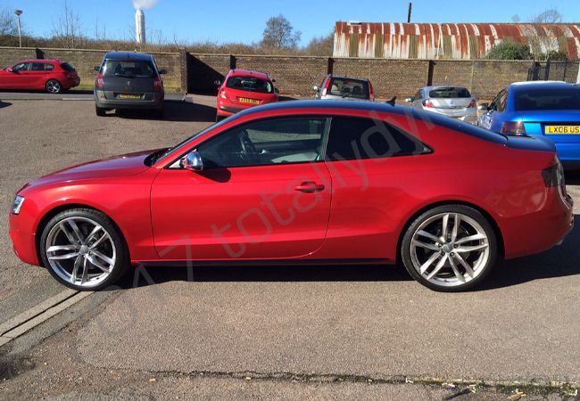 Audi S5 fully vinyl wrapped in a True Blood Red car wrap