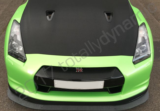 Nissan GTR vinyl wrapped in a pearlescent green car wrap with carbon fibre vinyl detailing