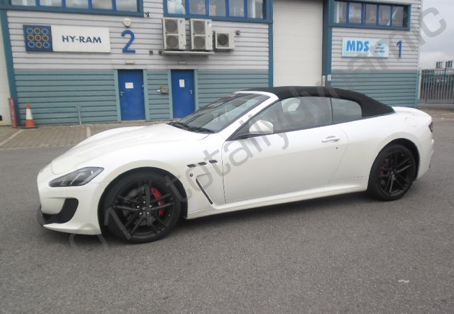 Maserati GT fully vinyl wrapped in a gloss metallic grey car wrap