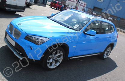 BMW X1 fully wrapped in printed colour-matched baby blue vinyl by Totally Dynamic North London