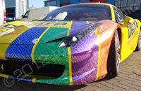 Ferrari 458 wrapped in yellow with printed chrome graphics by Totally Dynamic Southampton