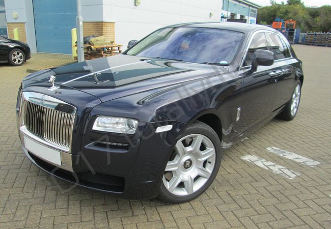 Rolls Royce Ghost fully wrapped in a gloss white vinyl car wrap