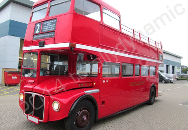 Routemaster bus fully vinyl wrapped in a printed vehicle wrap design for Woolworths by Totally Dynamic South London