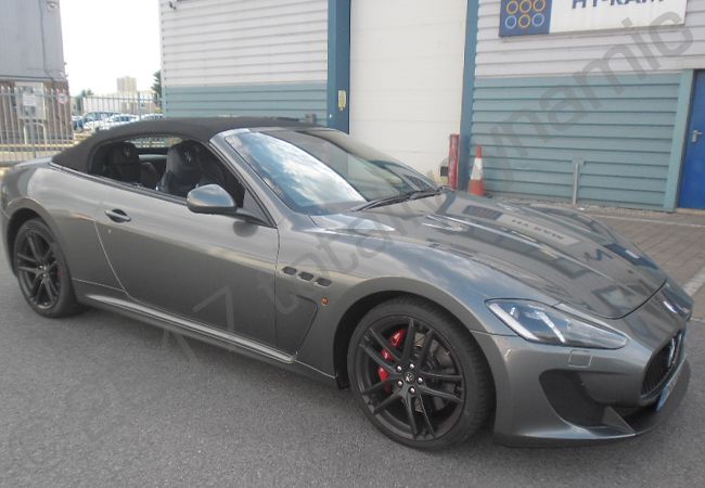 Maserati GT fully vinyl wrapped in a gloss metallic grey car wrap