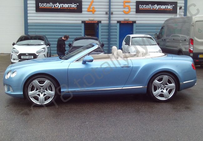 Bentley GTC fully vinyl wrapped in gloss dark blue