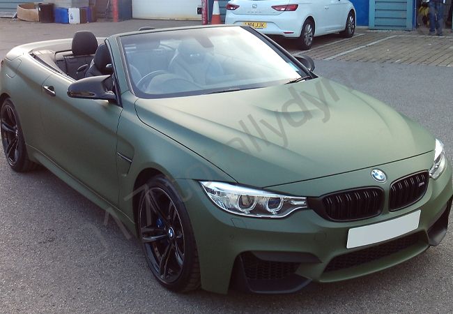 BMW M4 fully vinyl wrapped in a matt military green car wrap