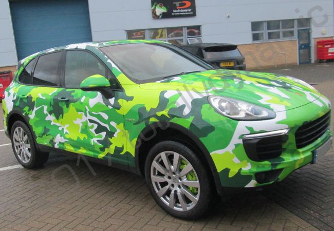 Porsche Cayenne vinyl wrapped in a printed green camouflage design