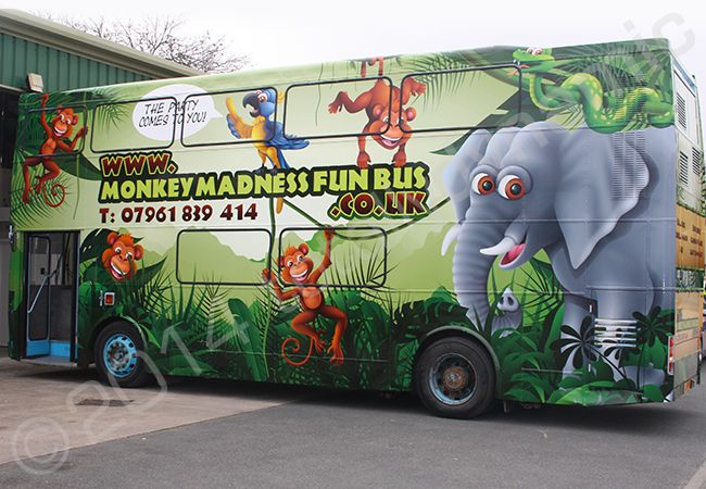 Double Decker Bus fully wrapped in a printed vinyl bus wrap for the Monkey Madness Fun Bus by Totally Dynamic Leeds