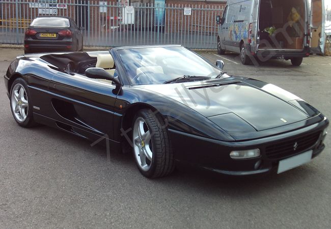 Ferrari F355 Spyder vinyl wrapped in a metallic black car wrap