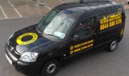Peugeot Partner van wrapped in gloss black vinyl with yellow graphics by Totally Dynamic North London