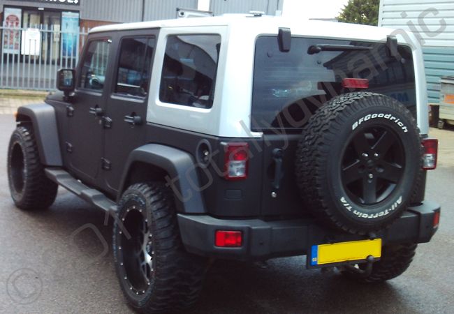 Jeep Wrangler fully vinyl wrapped in a matt black car wrap
