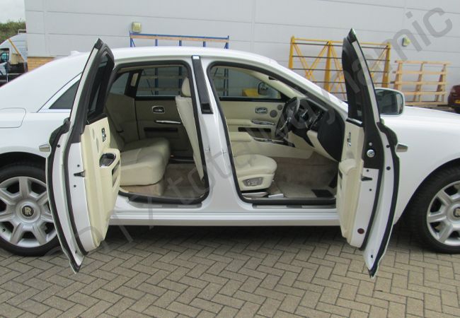 Rolls Royce Ghost fully wrapped in a gloss white vinyl car wrap