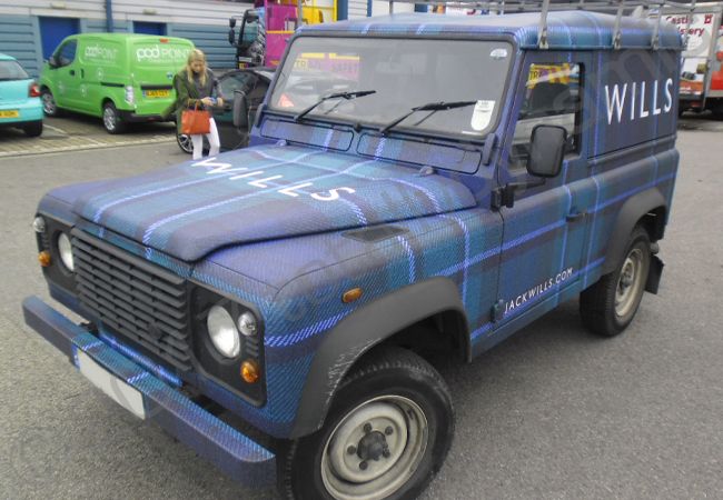Land Rover Defender vinyl wrapped for Jack Wills in a tartan car wrap