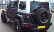 Jeep Wrangler fully vinyl wrapped in a matt black car wrap