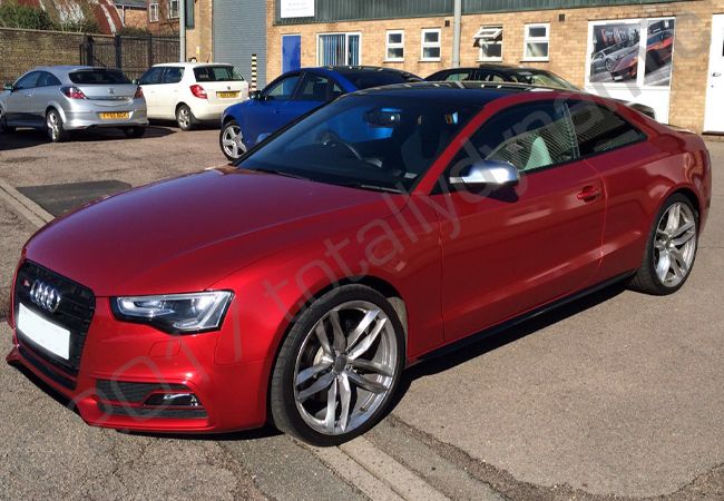 Audi S5 fully vinyl wrapped in a True Blood Red car wrap