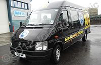 VW LT van fully wrapped in gloss black vinyl with print and cut graphics overlaid by Totally Dynamic North London