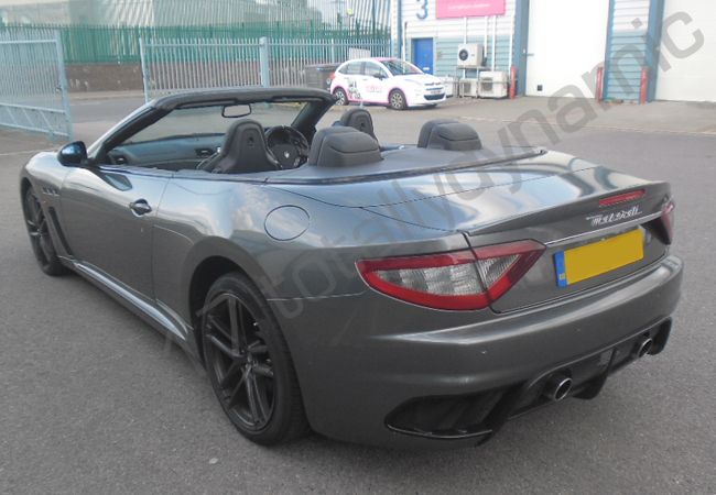 Maserati GT fully vinyl wrapped in a gloss metallic grey car wrap