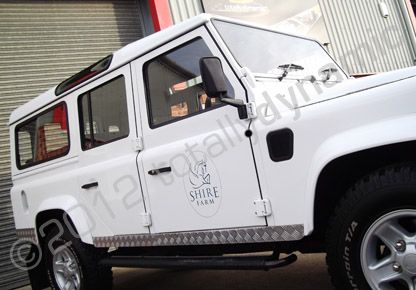 Land Rover Defender fleet wrapped in gloss white vinyl by Totally Dynamic Lincolnshire