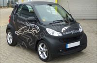 Smart car wrapped in matt black vinyl with chrome vinyl lettering by Totally Dynamic Milton Keynes