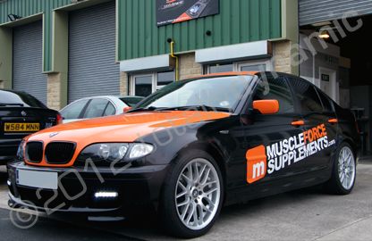 BMW 3 series fully wrapped in gloss black vinyl with gloss orange cut vinyl lettering by Totally Dynamic Leeds
