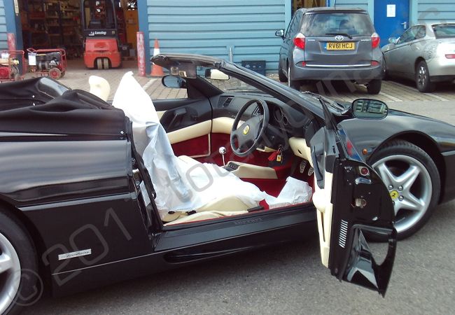Ferrari F355 Spyder vinyl wrapped in a metallic black car wrap