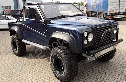 Modified Land Rover wrapped in dark blue metallic vinyl by Totally Dynamic South London