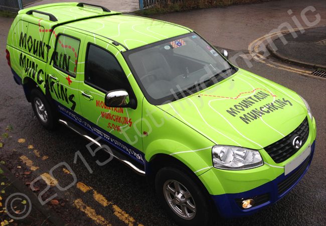 Nissan Navara fully vinyl wrapped for Mountain Munchkins in a printed vehicle wrap by Totally Dynamic Manchester