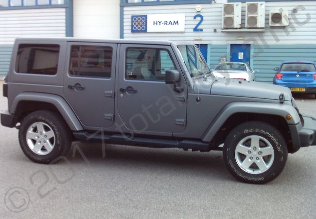 Jeep Wrangler fully vinyl wrapped in a matt metallic grey car wrap
